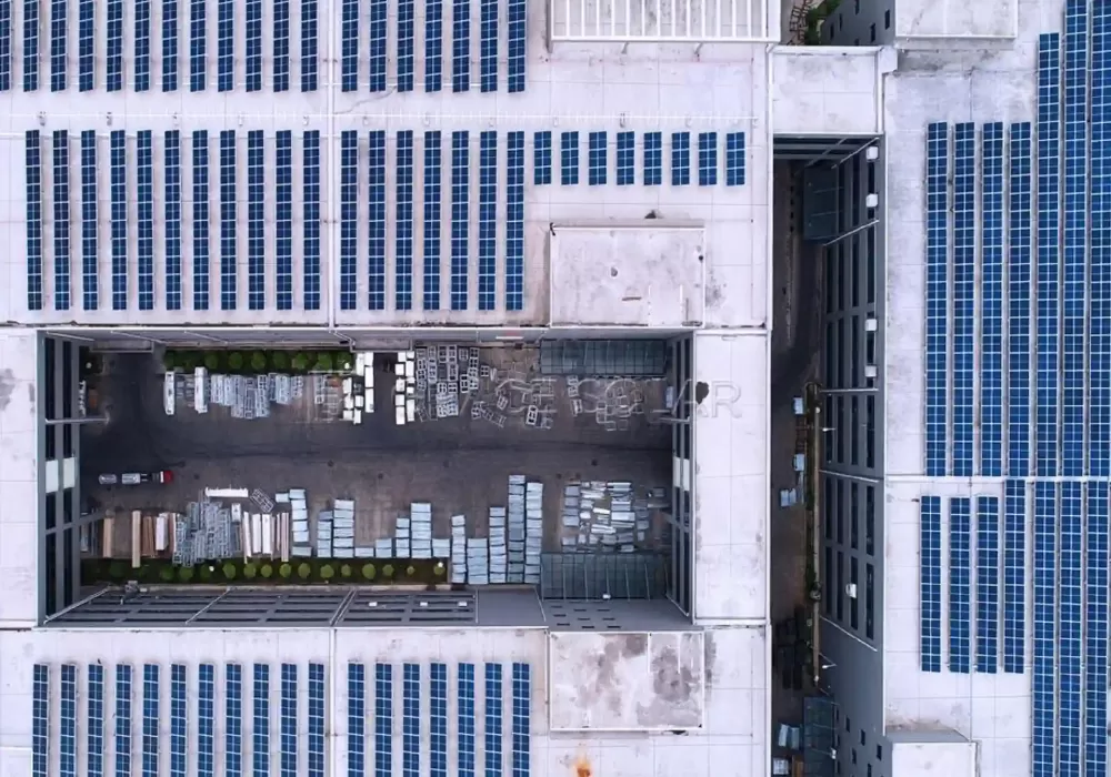 Commercial rooftop solar mounting system installation on factory building with optimized tilt structure