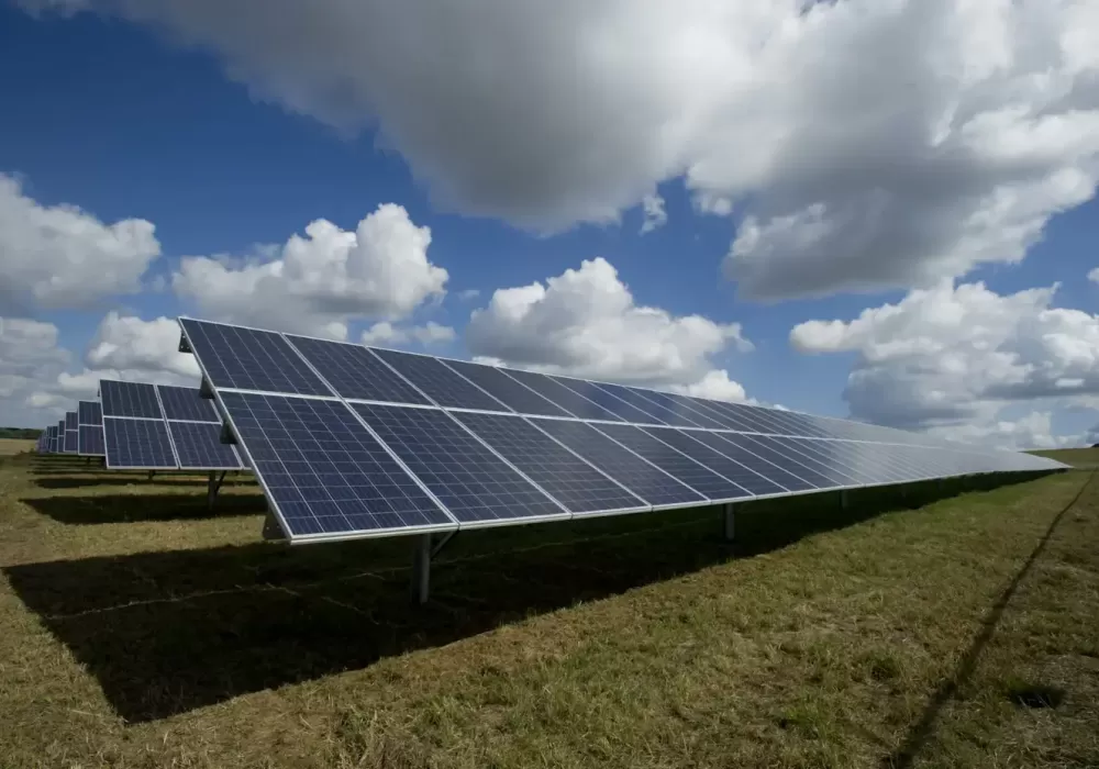 Industrial-scale solar tracking system with photovoltaic panels aligning with sunset angles for maximum energy yield