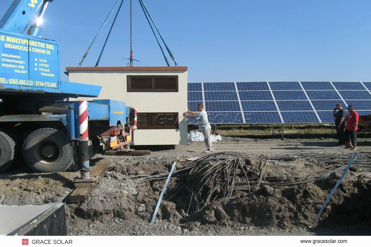 Installation team assembling GraceSolar ground mounting system in field