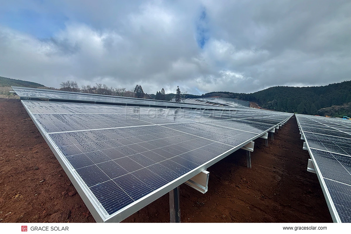 Grace Solar ground mount installation at Kumamoto project showing aluminum alloy structure on slopes