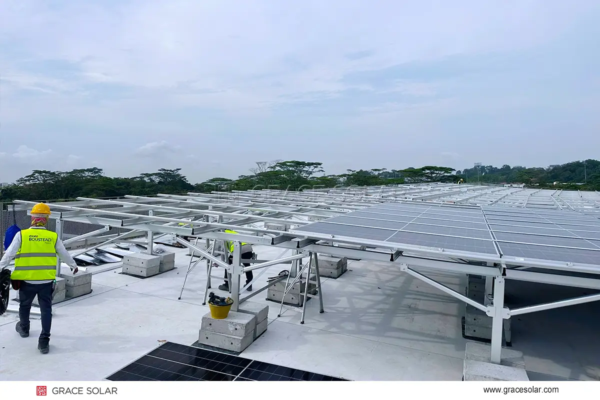 Installation team assembling Grace Solar rooftop mounting system